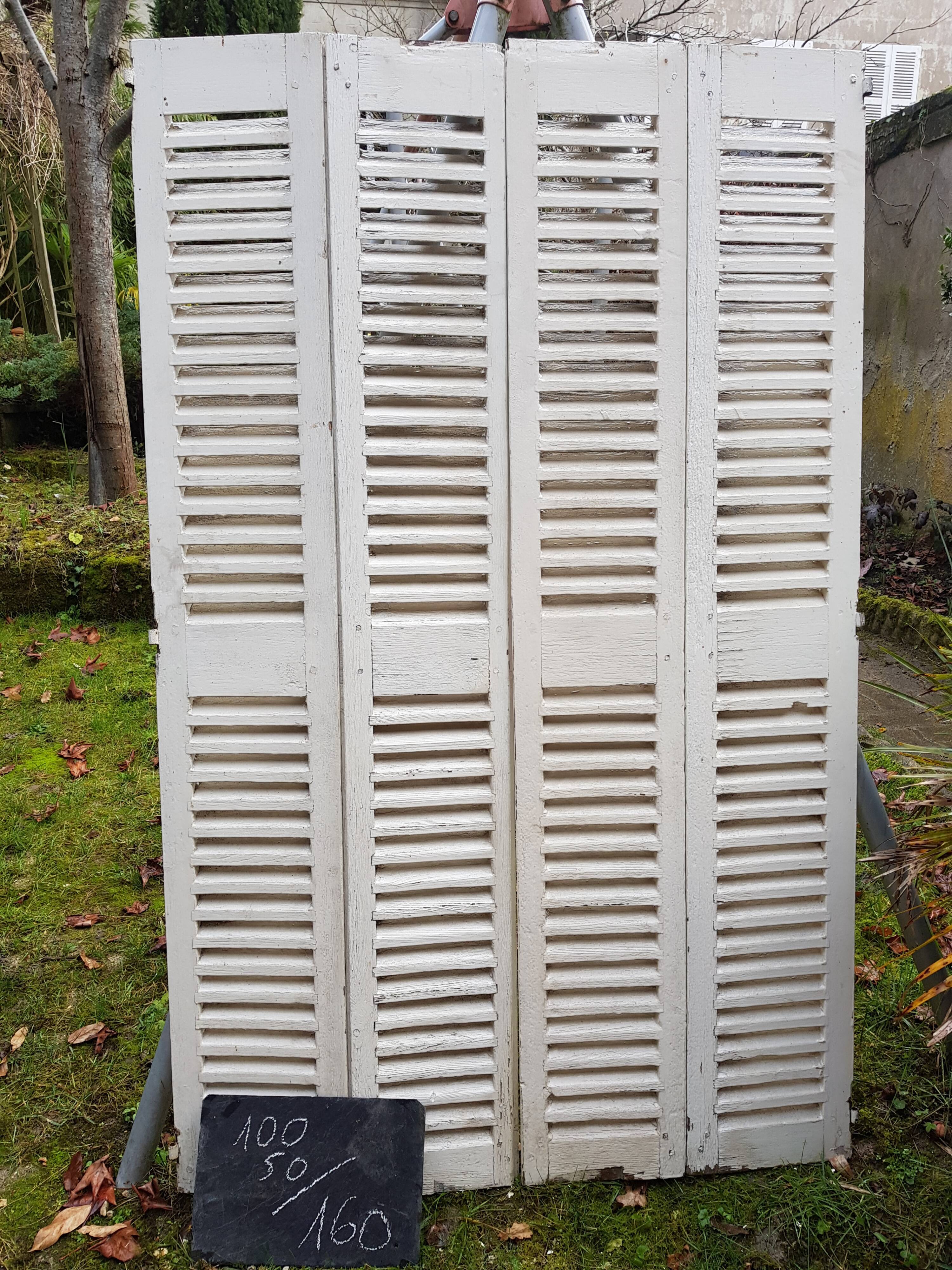 Pair of old shutters with louvers