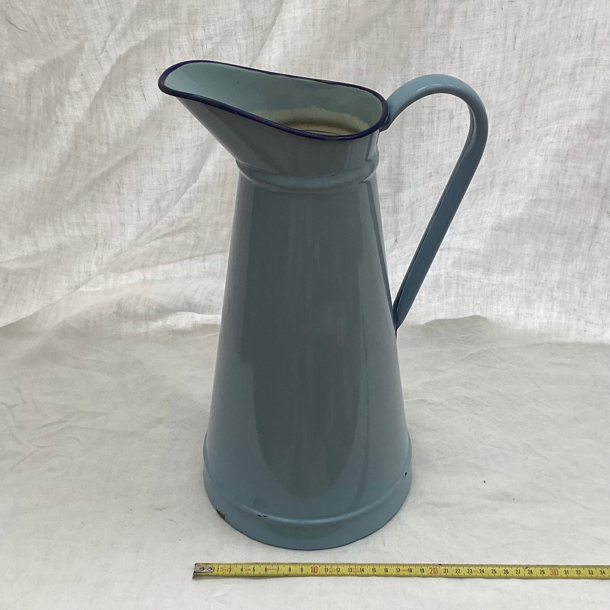 Old broc in enamelled sheet metal light blue color