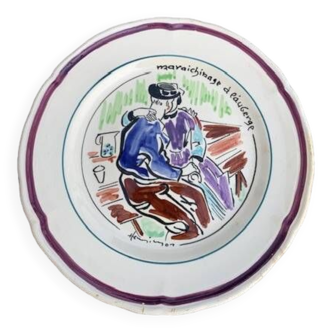 Collectible plate painted by Henry Simon, market gardening at the inn, in enameled ceramic,