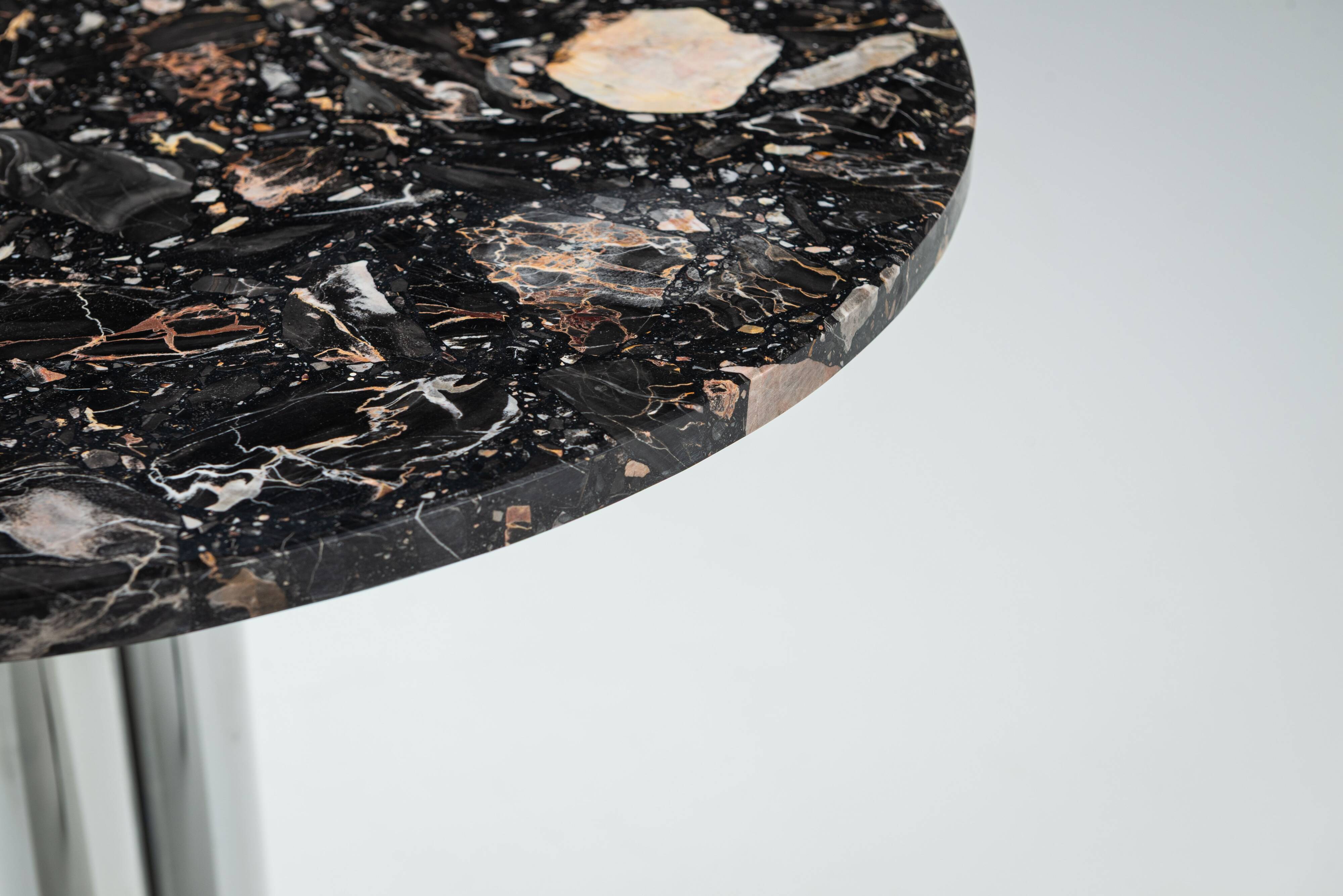 Round sidetable with stone top and three chromed legs