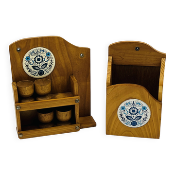 Wall-mounted egg cup holder and wooden utensil holder.