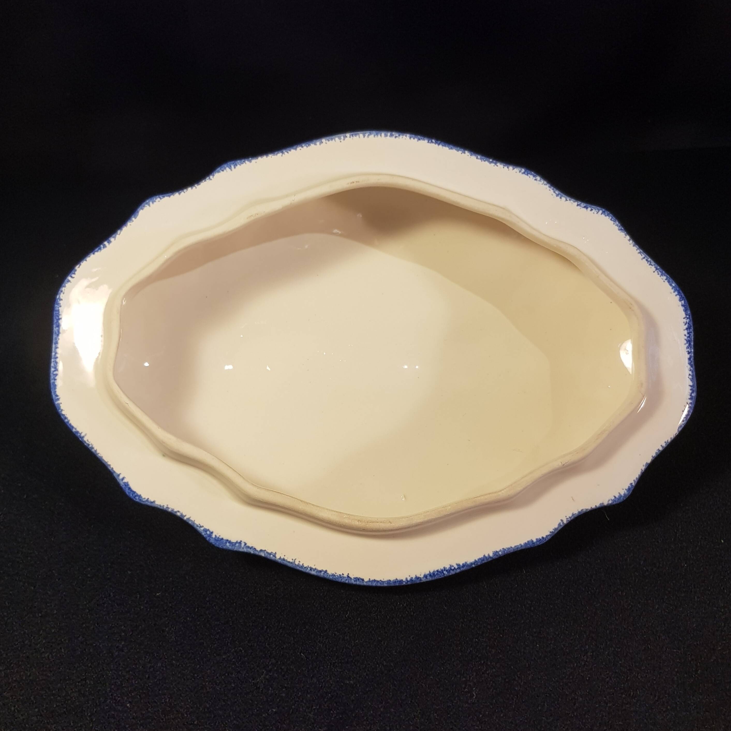 Vegetable soup tureen on Henriot Quimper display dish