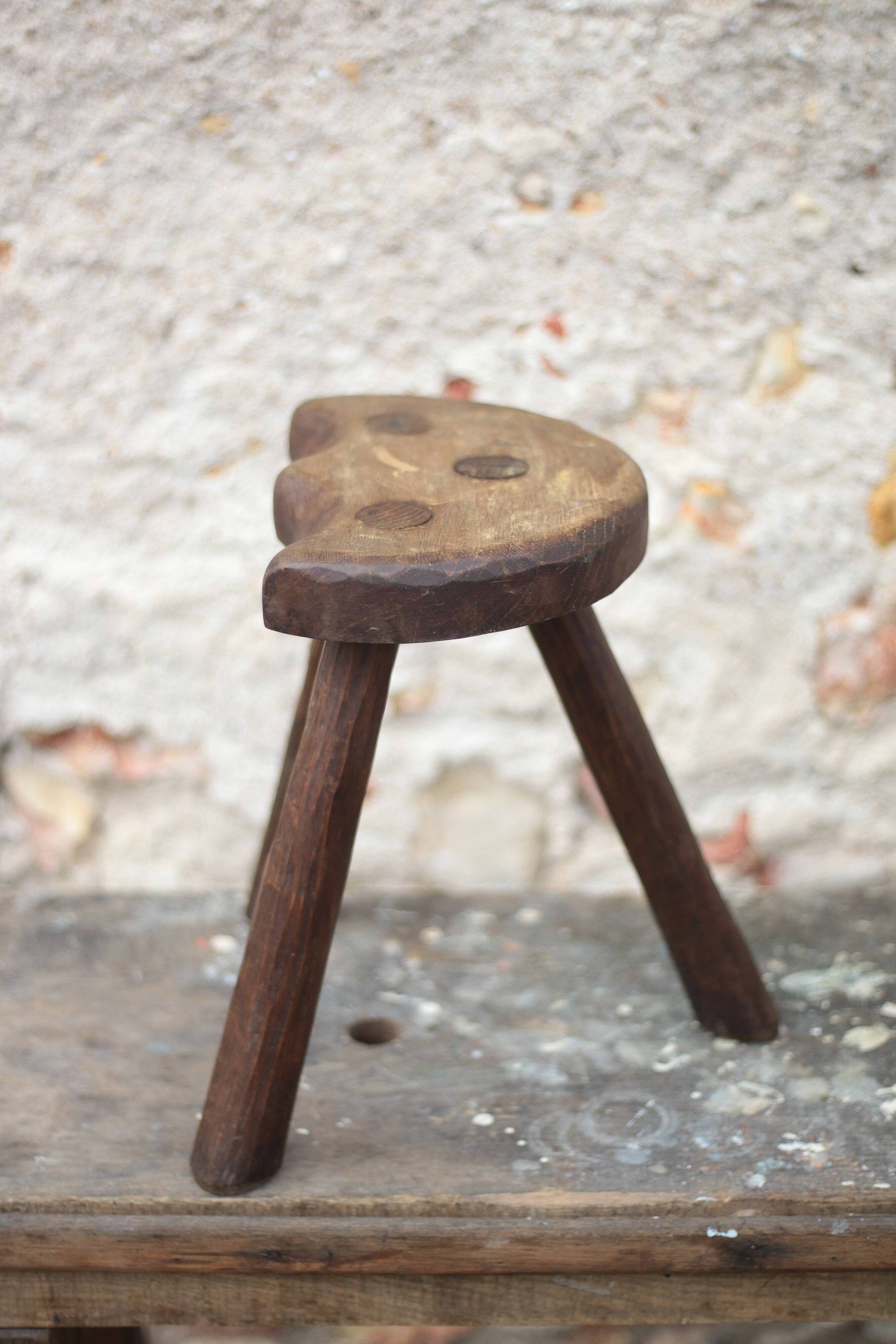 Vintage wooden tripod stool, mountain work, wabi-sabi, shepherd.