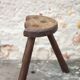 Vintage wooden tripod stool, mountain work, wabi-sabi, shepherd.