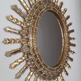 Miroir soleil en bois doré 65x75cm