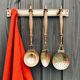 Brass holder with 3 brass & wood utensils
