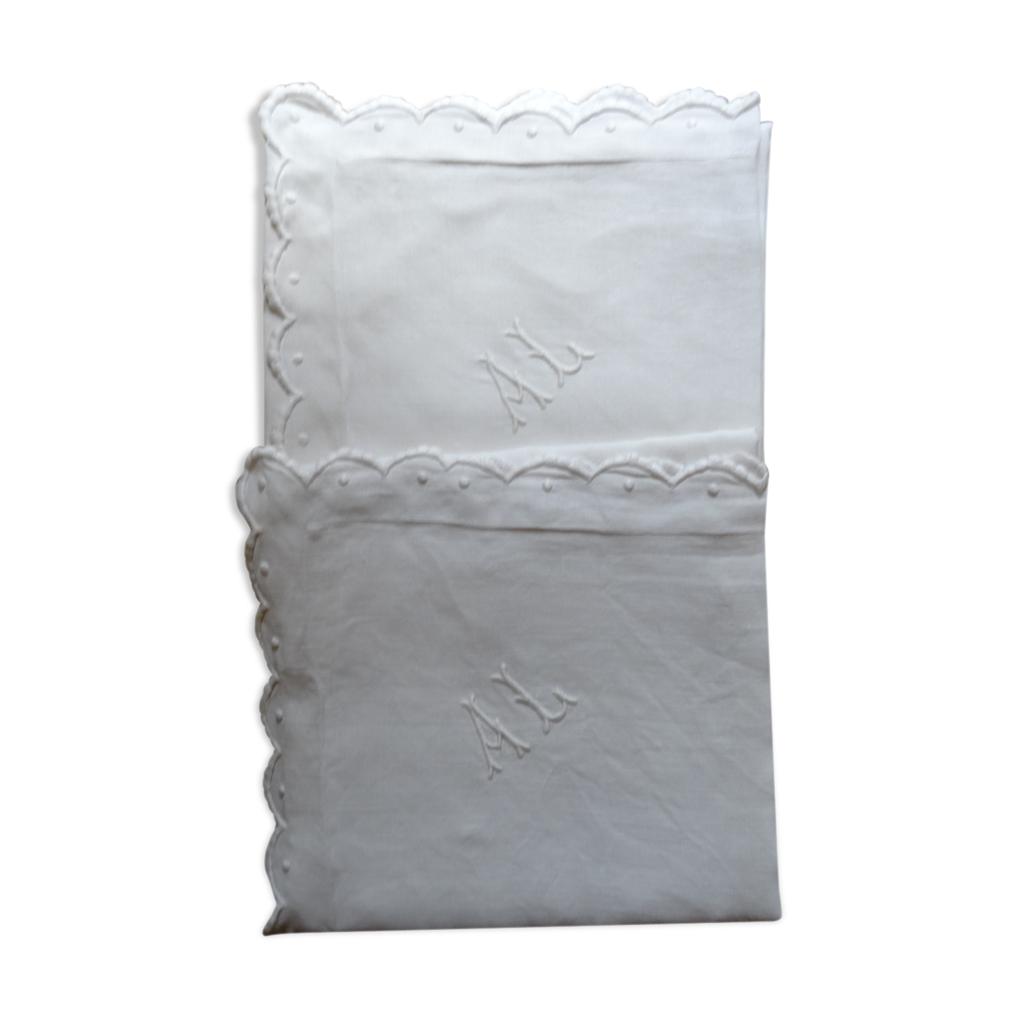Pair of AL monogrammed pillowcases
