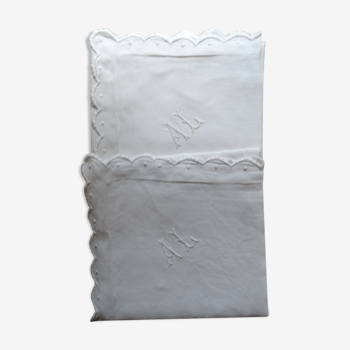 Pair of AL monogrammed pillowcases