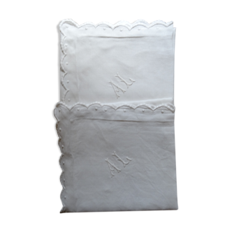 Pair of AL monogrammed pillowcases
