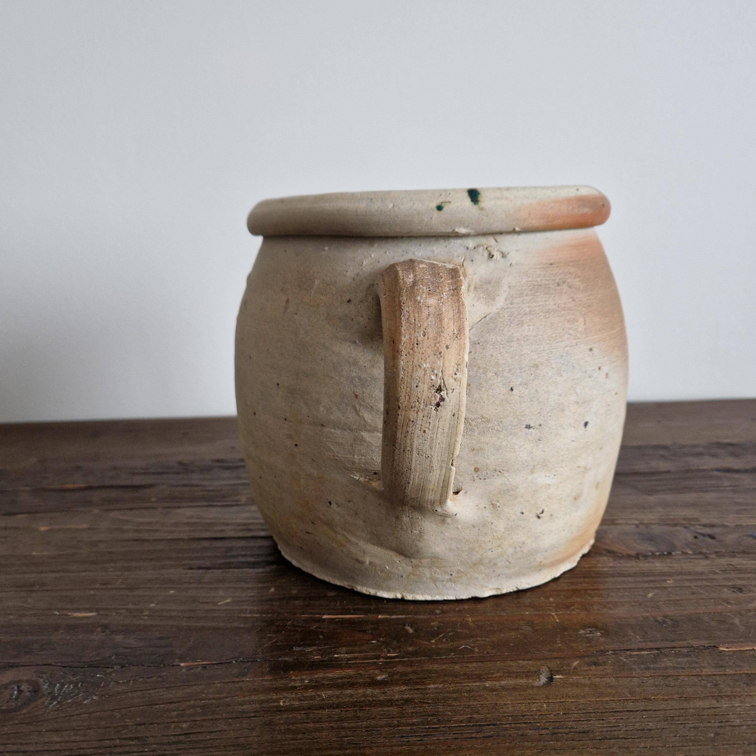 Ancient terracotta pot with a handle