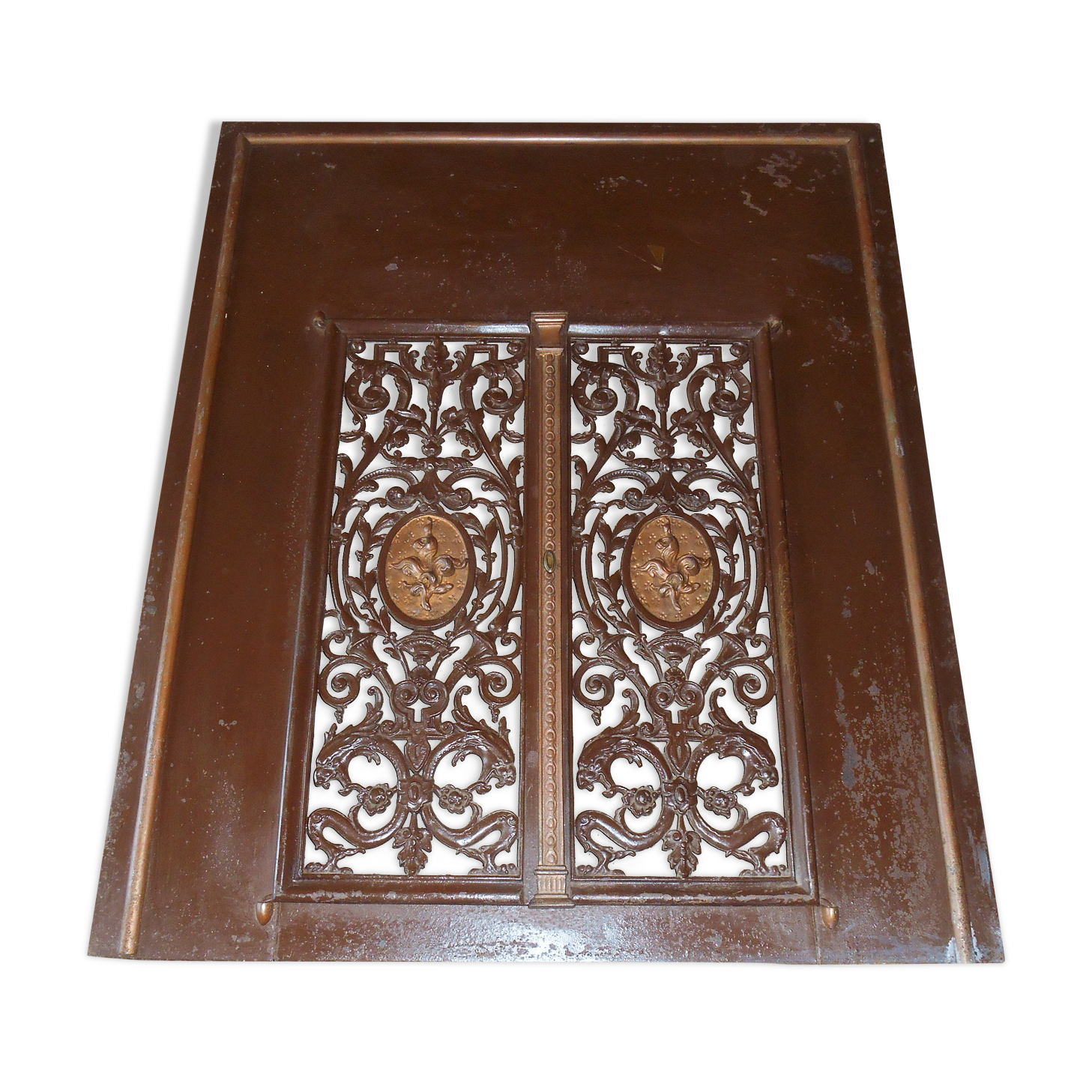 Pair of cast iron door grilles with its coat