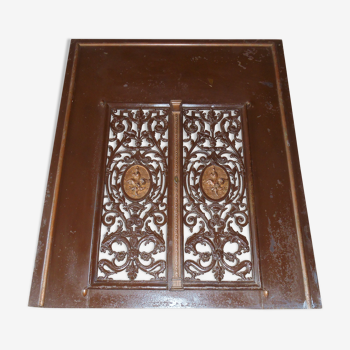 Pair of cast iron door grilles with its coat