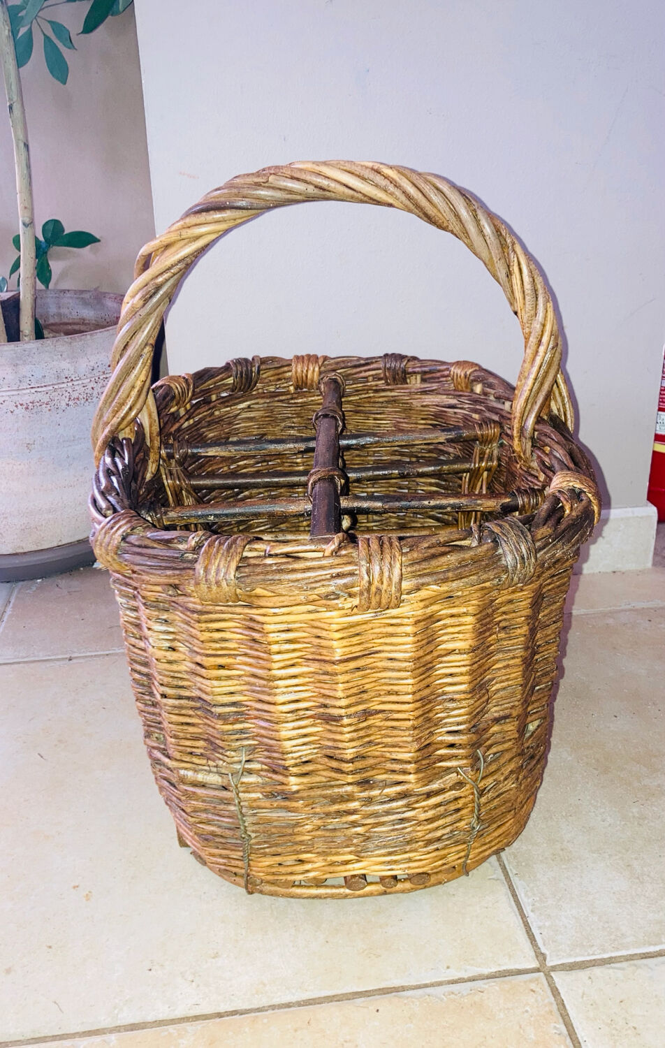 Wicker and hazel bottle basket from the early 20th century or possibly earlier.