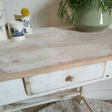 Old table in patinated white wood