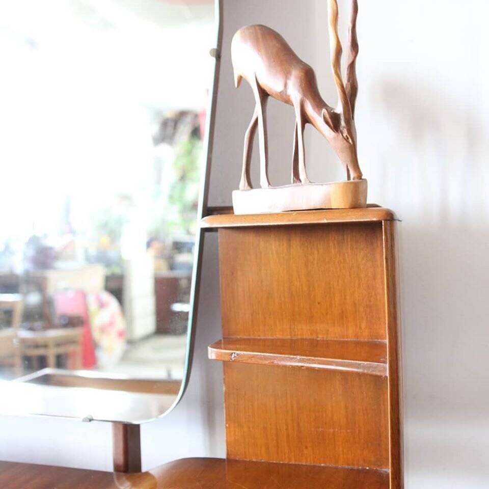 Vintage 1950s brown wooden dressing table with a double mirror and integrated storage.