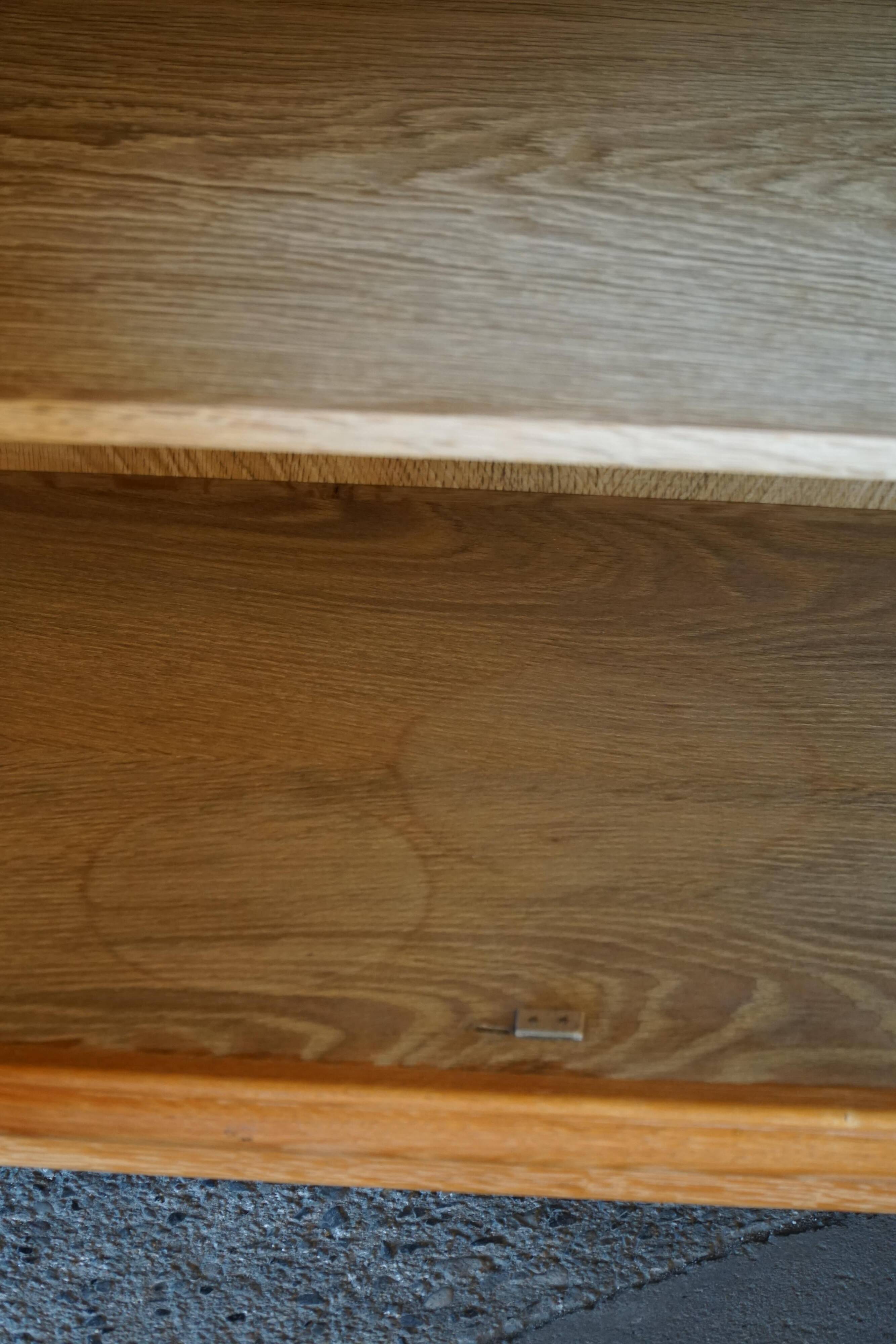 Modern Danish low enfilade in oak with panelled doors, mid-20th century.