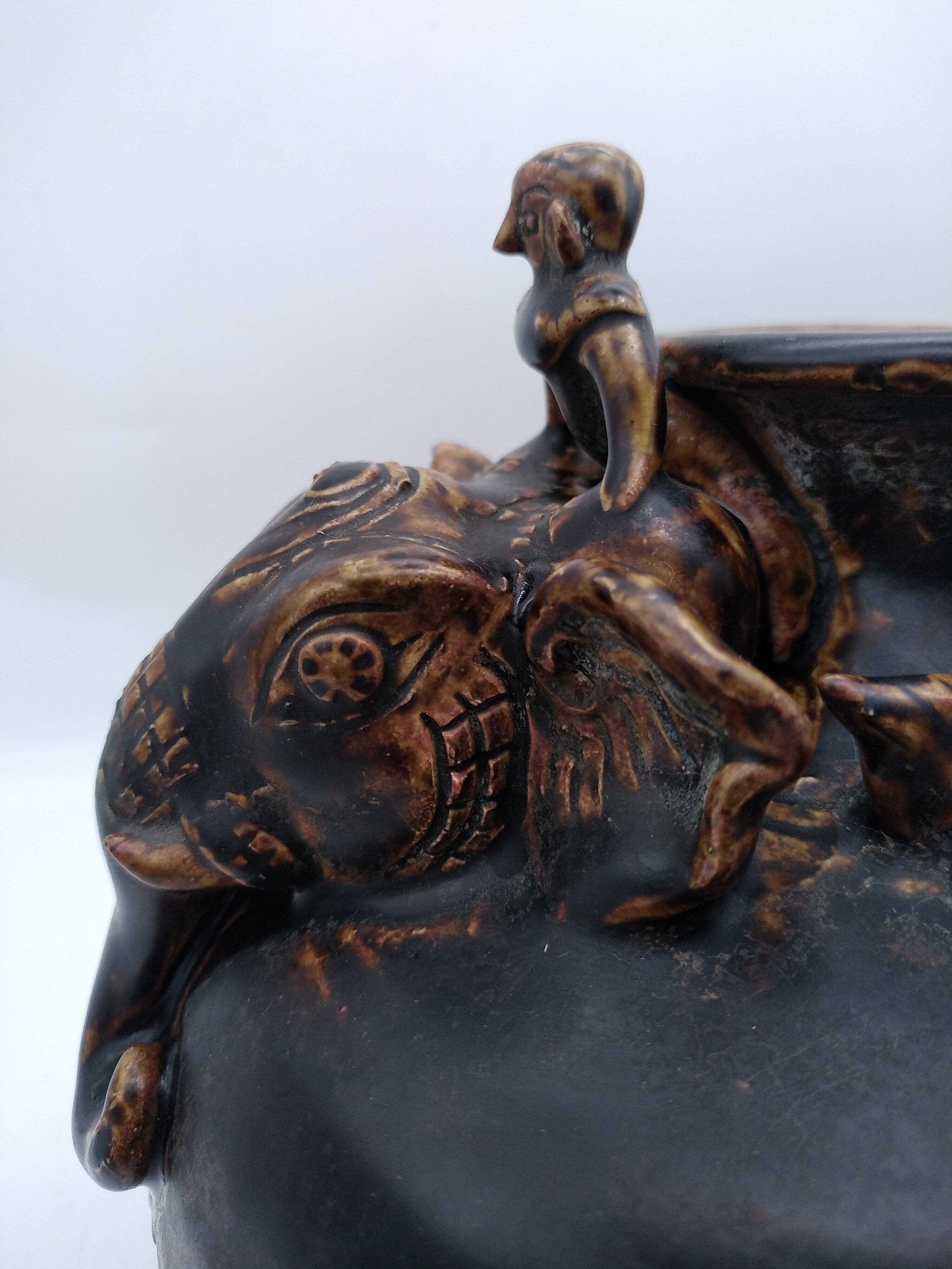 Antique Khmer ceramic vase. With elephant decoration.