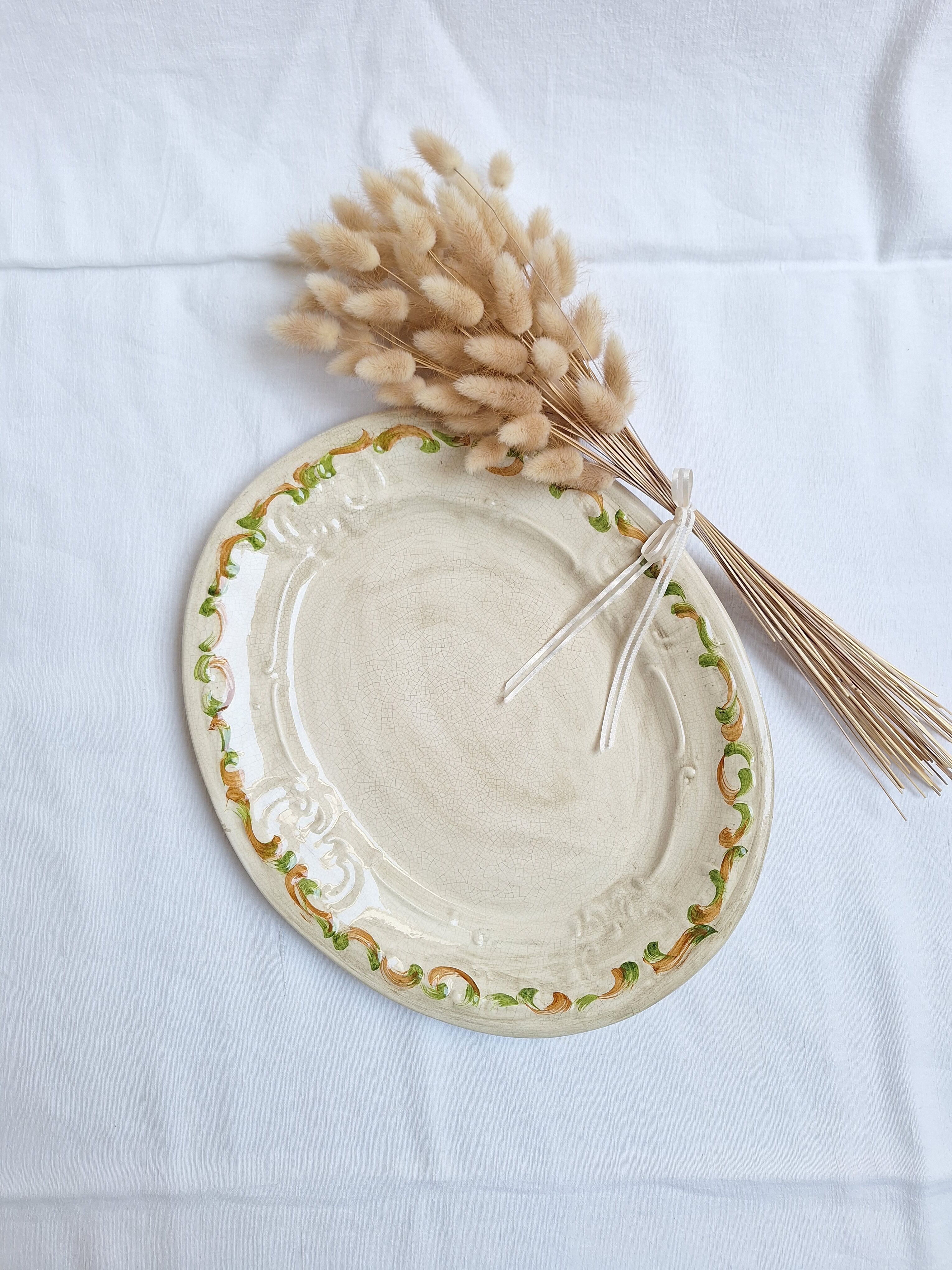 Oval plate, hand-painted meat platter in orange and green.