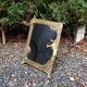 Art Nouveau mirror in gilded brass with a woman figure emerging from a vintage frame