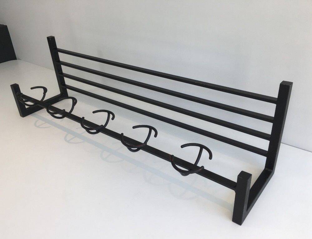 Designer coat rack in blackened metal