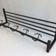 Designer coat rack in blackened metal