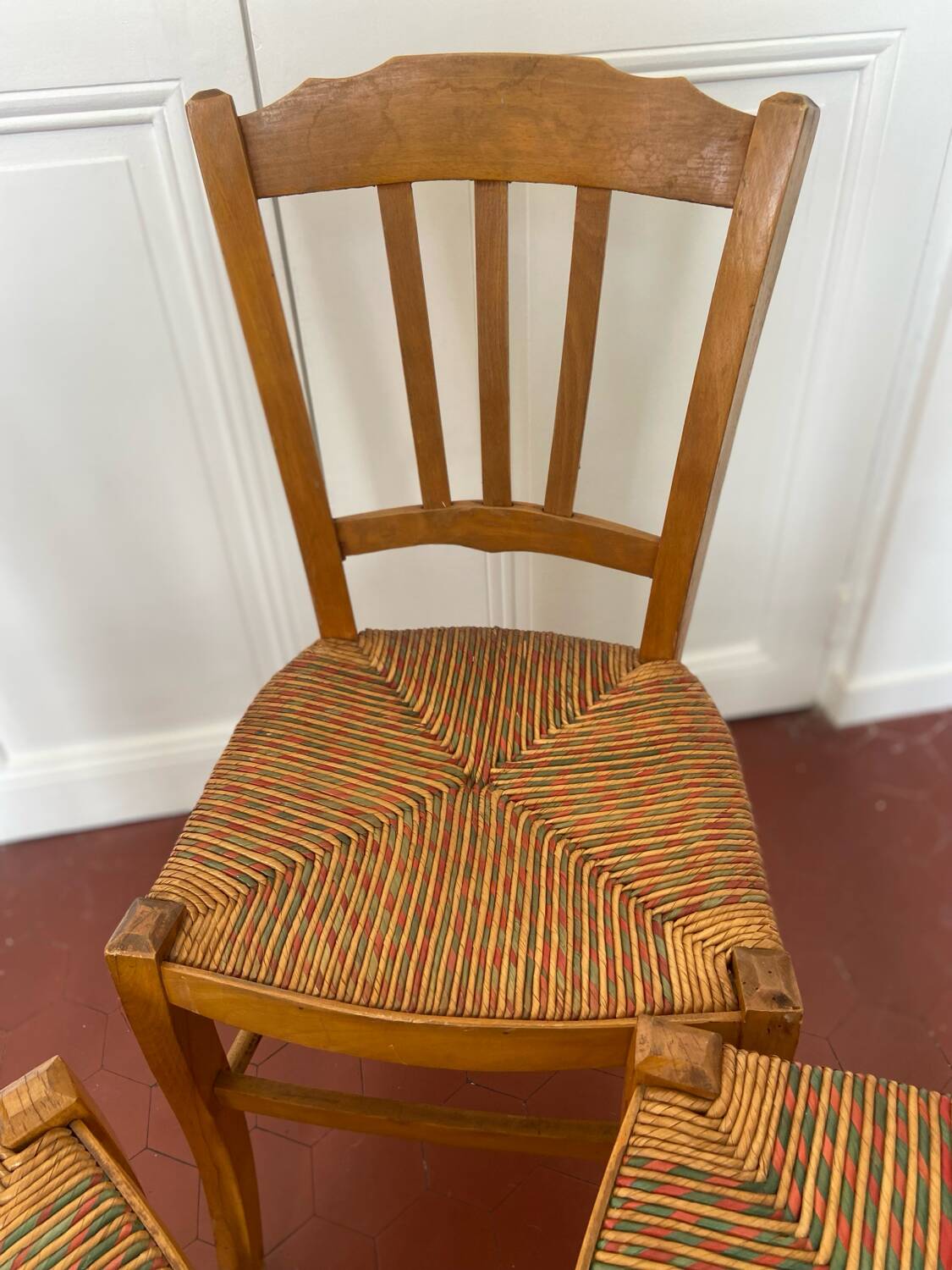 Trio of vintage straw/colored chairs
