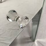 Bedside table covered with beveled mirrors on all sides