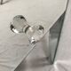 Bedside table covered with beveled mirrors on all sides