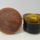 Set of 3 stackable glass catchalls with a teak base.