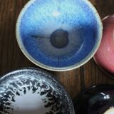A set of 4 pottery bowls in coloured glaze.