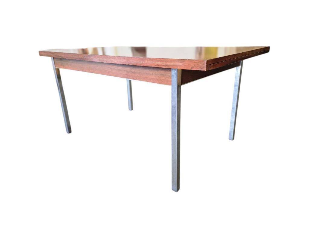 Vintage wooden dining table with chrome frame.