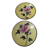 Pair of vintage Chinese decorative plates with floral decoration on a yellow background