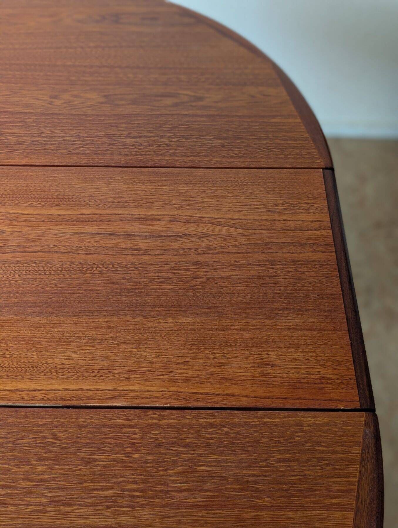 Round teak table with star base, 1960s, extendable.