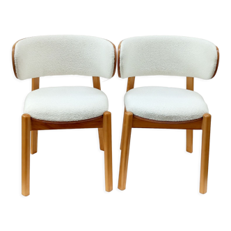 2 white buckle chairs