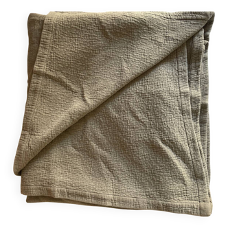 Almond-colored Caravan bedspread