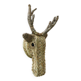 Trophy animal head in palm leaves - deer