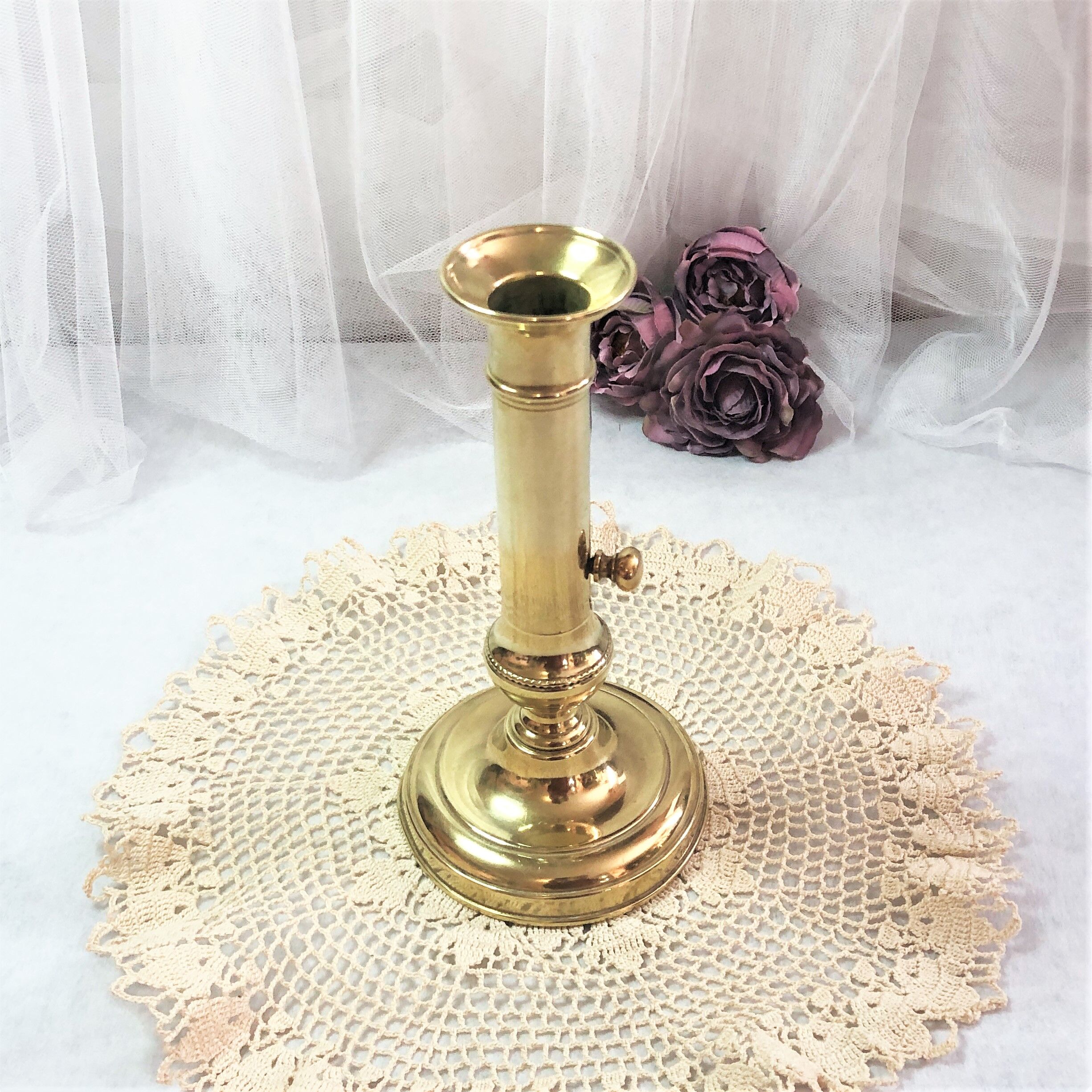 Gilded copper push candle holder