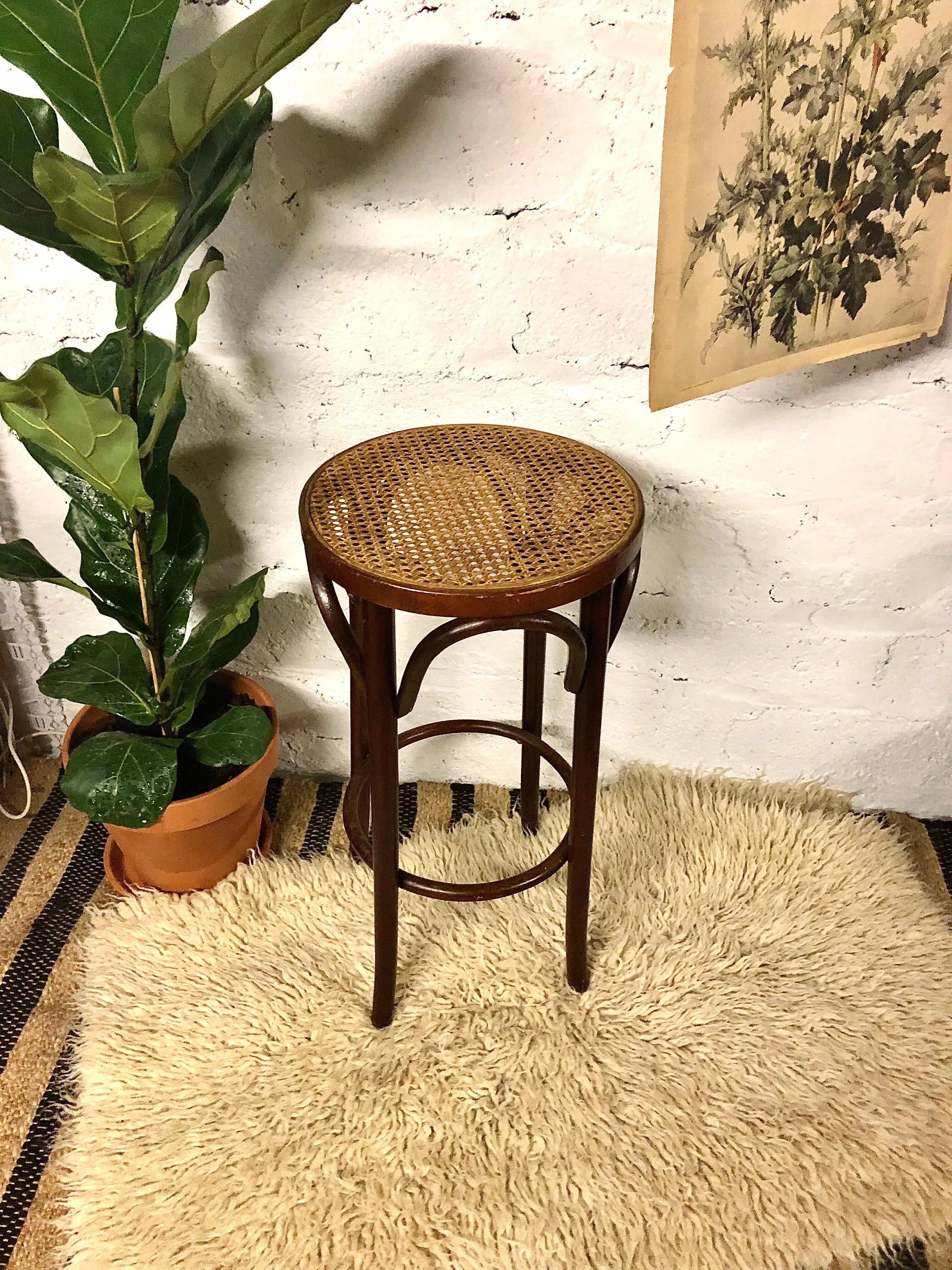 Curved wooden bar stool and cannage