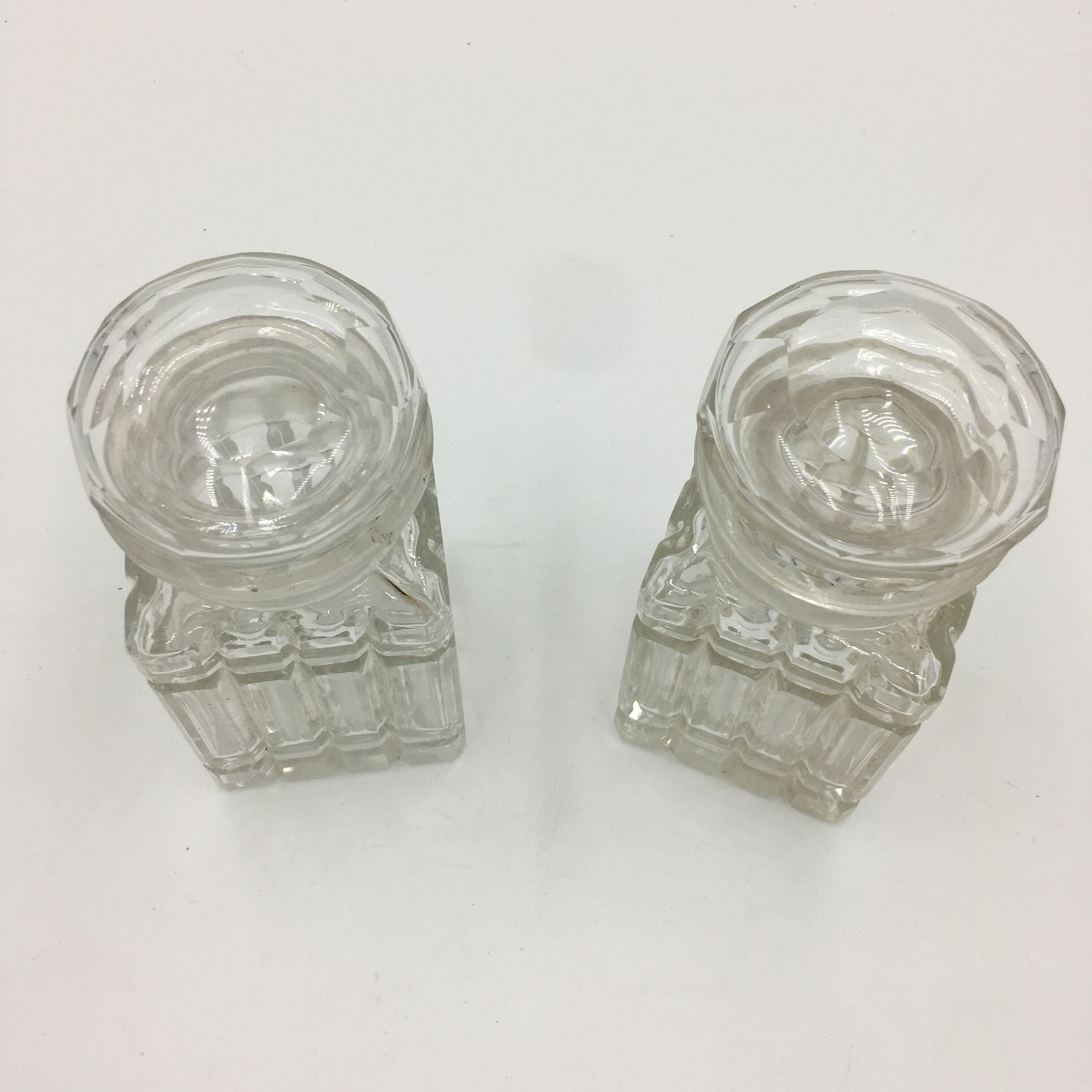 Duo of chiseled glass jars