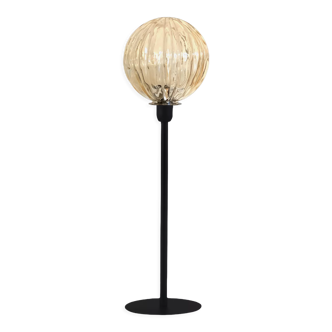 Table lamp with a golden streaked globe shade
