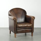 Armchair / lounge chair made of sheepskin leather with characterful patina