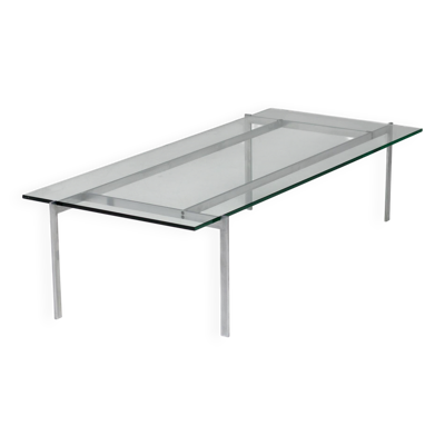 Table basse rectangulaire architecturale en acier et verre.