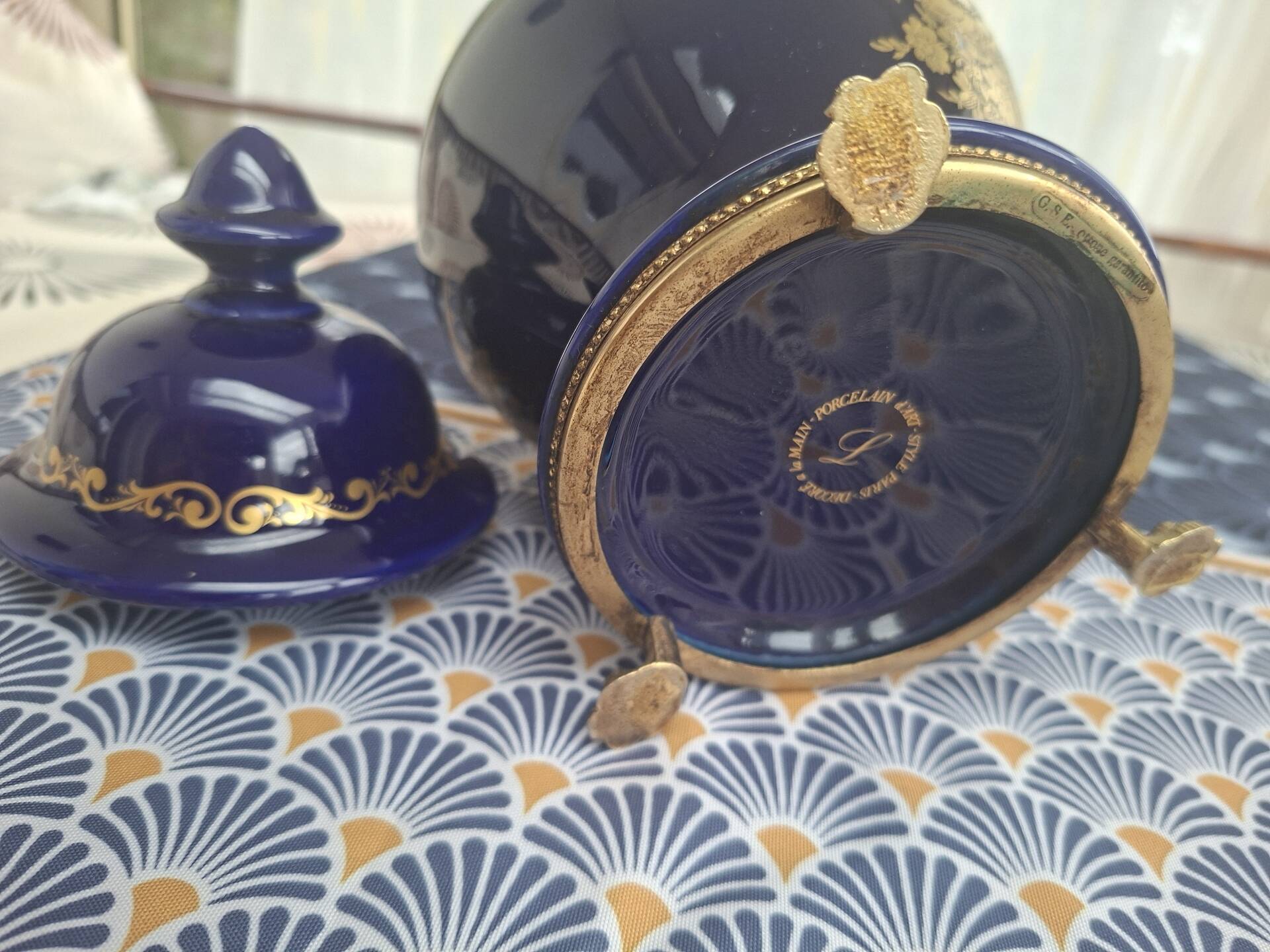 Cobalt blue porcelain bonbonnière with gold decoration on feet.