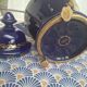 Cobalt blue porcelain bonbonnière with gold decoration on feet.