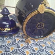 Cobalt blue porcelain bonbonnière with gold decoration on feet.
