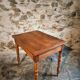 French vintage side table in cherry wood with a drawer.