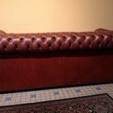 Old red leather Chesterfield sofa
