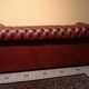 Old red leather Chesterfield sofa