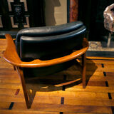 Pair of scandinavian armchairs in black leather and teak