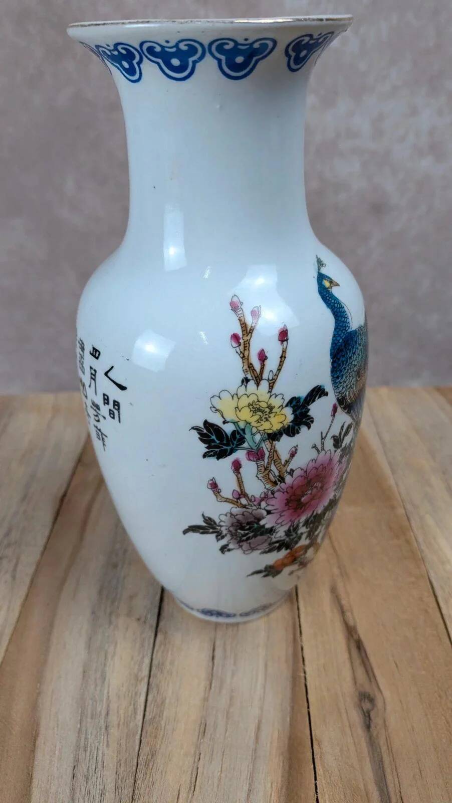 Asian vase decorated with peacock in porcelain